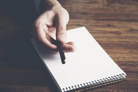 Man hand pen with notepad Stock Photos