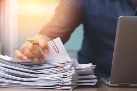 Man hand with pen Picking document For working from home, concept of social d Stock Photos