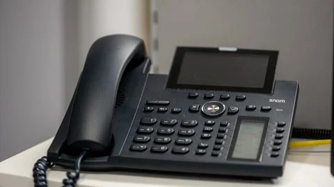 Man hand picking up a ringing office telephone/landline Stock Footage 122055252