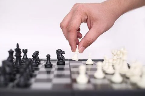 Man hand playing chess Stock Photos