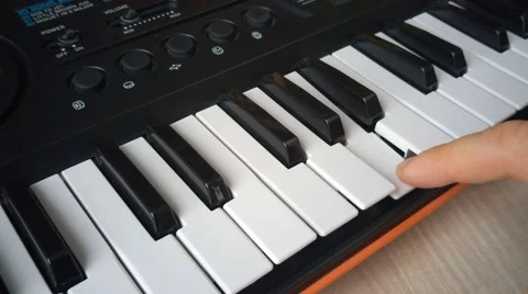 Man hand playing synthesizer Stock Footage 68995872