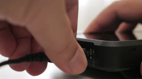 Man hand plug and unplug HDMI cable into external monitor closeup. Stock Footage 157714225