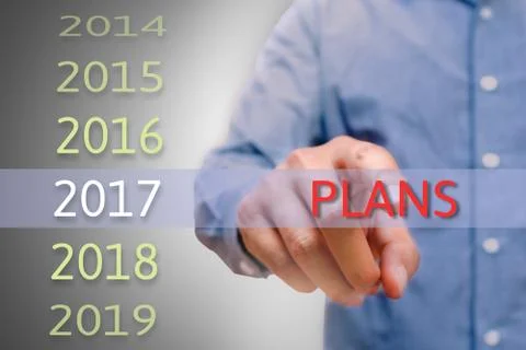 Man hand pointing plans text, Body man, businessman planing work for 2017. .. Stock Photos