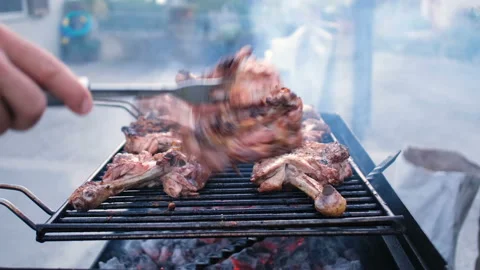 Man hand preparing grilled chiken legs,grilling meat barbecue,outdoors lifestyle Stock Footage 137472817