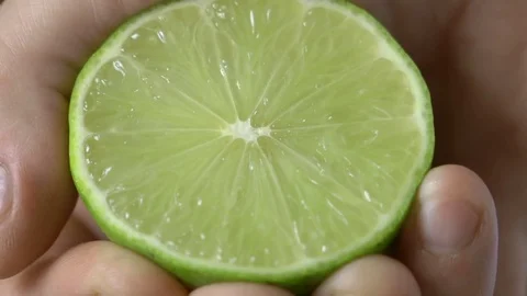 Man hand presses a lime on kitchen Stock Footage 81788347