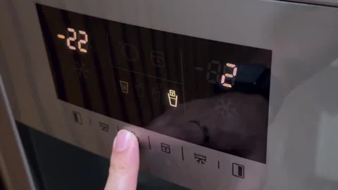 Man hand pressing button on refrigerator for ice Stock Footage 329460758