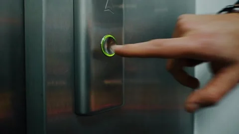 Man Hand Pushing Elevator Button in Office Center Stock-Footage 130815882