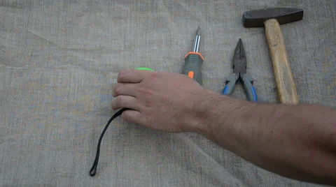 Man hand put hammer pliers screwdriver measure knife tools Stock Footage 36729533
