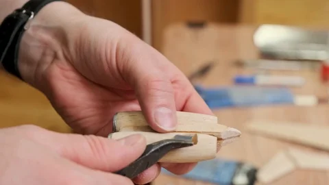 Man hand puts detail on outdated jetliner model engines Stock Footage 127374898