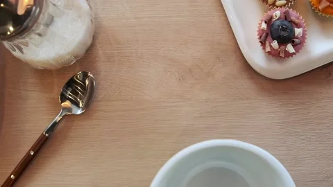 Man hand puts an empty cup for tea wooden table Stock Footage 159582085