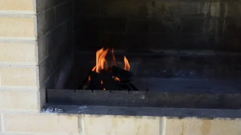 Man hand putting coal in a brick barbecue for cooking, close-up Stock Footage 282862148