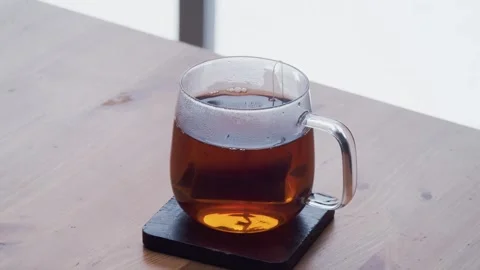 Man Hand Putting Down Hot Tea Cup Steam Macro Stock Footage 330091813