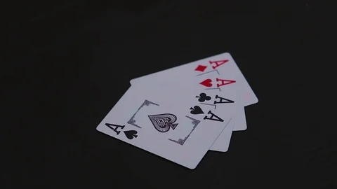 Man hand putting four ace poker cards on the black table Video stock 77041847
