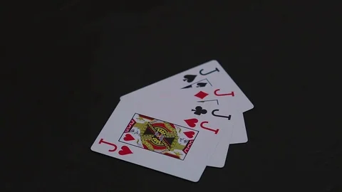 Man hand putting four jack poker cards on the black table Video stock 77041864