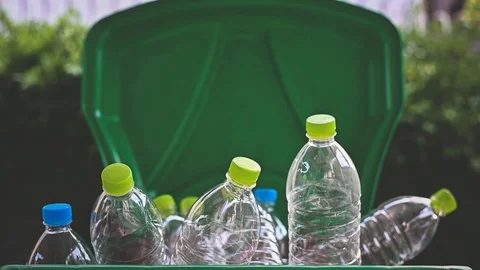 Man hand putting plastic reuse for recycling concept Stock Footage 106950834