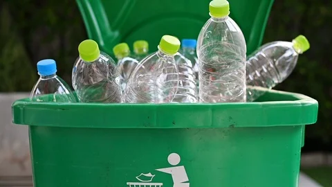 Man hand putting plastic reuse for recycling concept Stock Footage 106950970