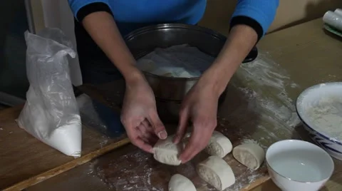 Man hand putting raw steamed buns to the pot Stock Footage 47697943