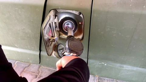 Man hand refueling filling car benzine gasoline fuel at gas station.fuel nozzle Stock Footage 282648314