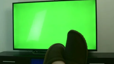 Man Hand With Remote Controller Changing Channels On A Green Screen TV At Home Stock Footage 84166120