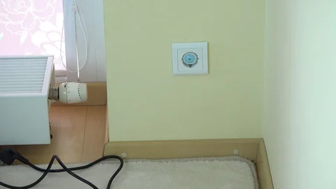 Man hand remove safety plug from wall socket and insert plug wire Stock Footage 91370682