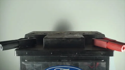 Man Hand Removing Plus And Minus From A 12V Car Battery, Isolated On White Stock Footage 39657470