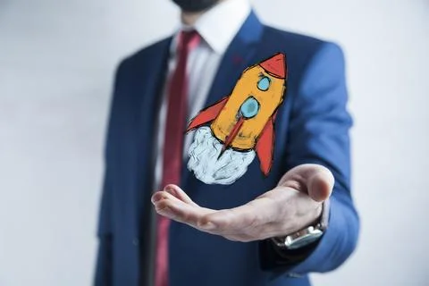 Man hand rocket in screen Stock Photos