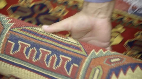 Man hand roll open muslim prayer mat Stock-Footage 104860662