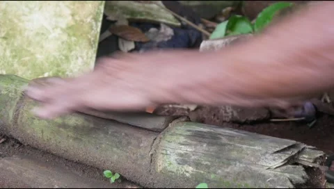 A man hand sharpening a machete on a sharpening stone Stock Footage 311271419
