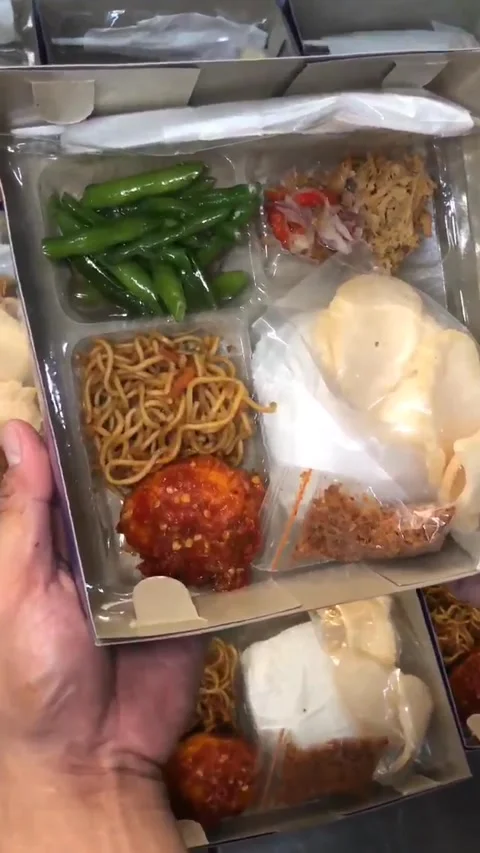 Man Hand showing rice box for Ramadan and IED Mubarak Stock Footage 299849073