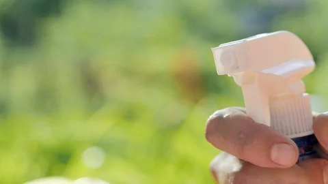 Man hand, sprinkling with spray bottle Stock Footage 90048552
