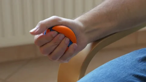 Man Hand Squeezing Stress Ball Stock Footage 165045605