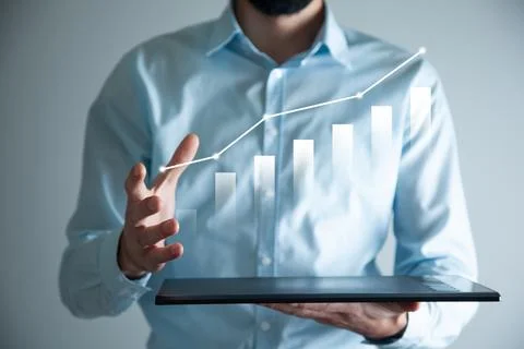 Man hand tablet with graph in screen Stock Photos