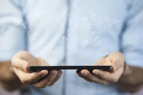 Man hand  tablet  on  world map Stock Photos