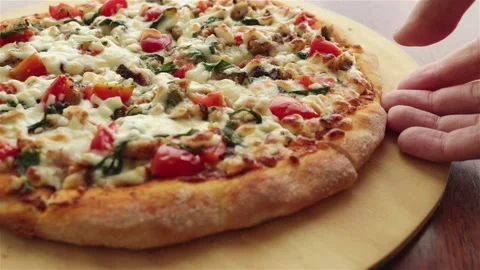 Man hand take a slice of hot pizza with melt cheese   close up Stock Footage 106512050