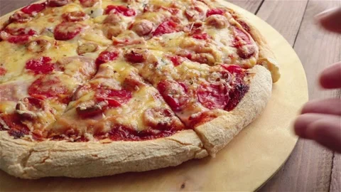 Man hand take slice of pizza with stretching cheese close up Stock Footage 113755749