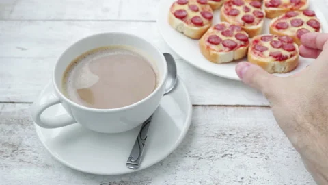 Man hand takes mini pizza sandwich from white plate .morning breakfast close up Stock-Footage 120167440