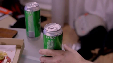 Man hand taking beer can from table and putting it back Stock Footage 83137198