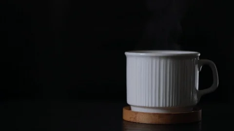 Man hand taking A good and hot espresso cup -  close up of a white coffee mug fu Stock Footage 119956382