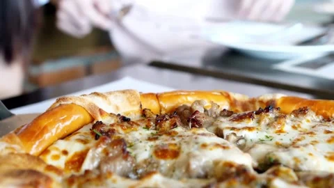 Man hand taking pizza slice at workplace closeup. Two hungry startupers enjoying Video stock 336586641
