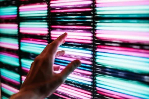 Man hand touch neon panel Stock Photos