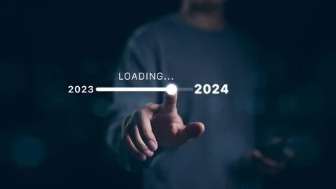 Man hand touching loading bar for countdown to 2024. Stock Photos