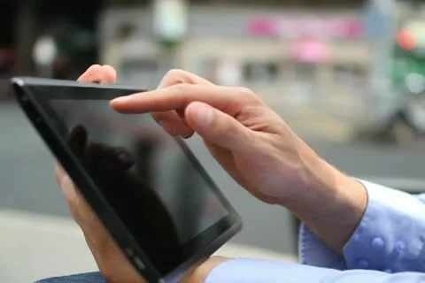 Man hand touching screen on digital tablet NTSC Video stock 10881796