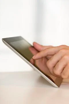 Man hand touching screen on digital tablet pc. close-up. Stock Photos