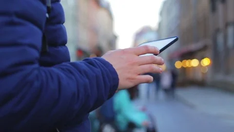 Man hand touching tablet computer surface touch green screen on street London. Stock Footage 76563466
