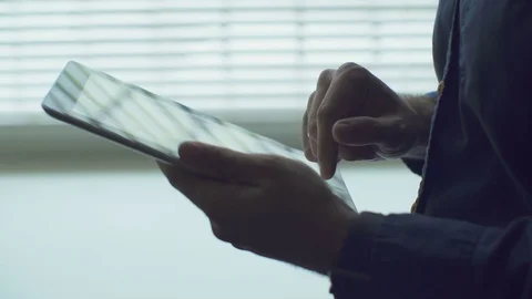 Man hand touching tablet computer surface touchscreen Stock Footage 79136161