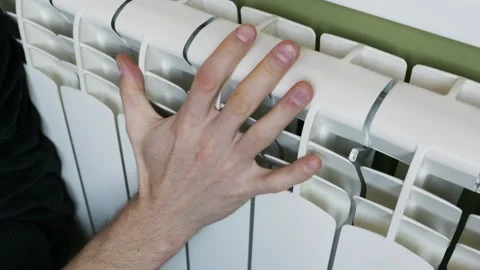 Man Hand Touching White Central Heating Radiator Checking Warmth Stock Footage 328656517