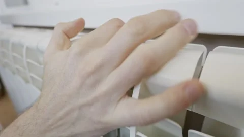 Man Hand Touching White Radiator To Check Heating Temperature Stock Footage 329808388