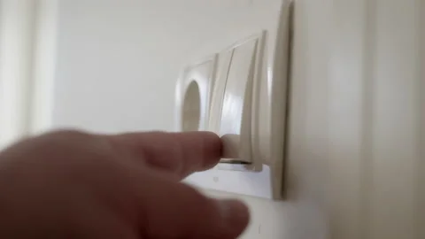 Man hand turn off light in room. button of inclusion and switching off of light Stock Footage 232345164