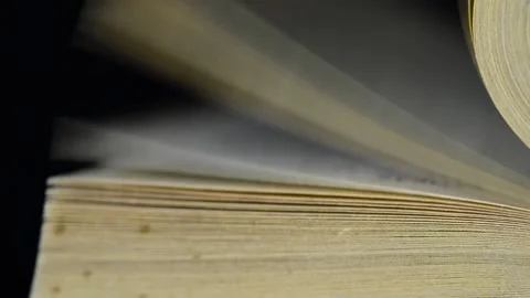 Man hand turning aged, old yellow book pages Stock Footage 146175372