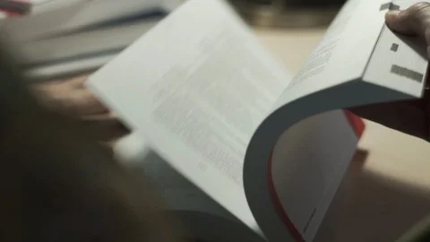 Man Hand Turning Book On Table In Library Close Up Stock Footage